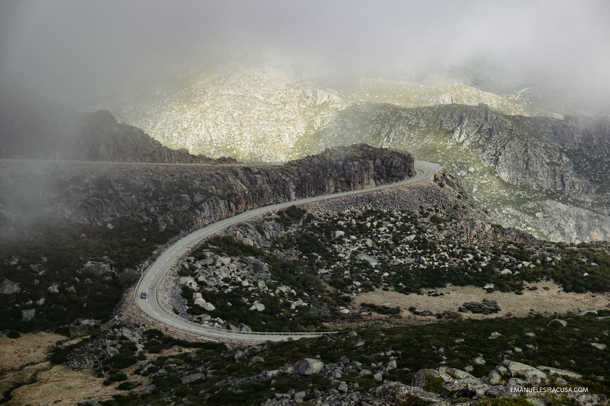 A Mountain road on the way up to Torre, the top of Serra da Estrela, in beautiful atmospheric light.